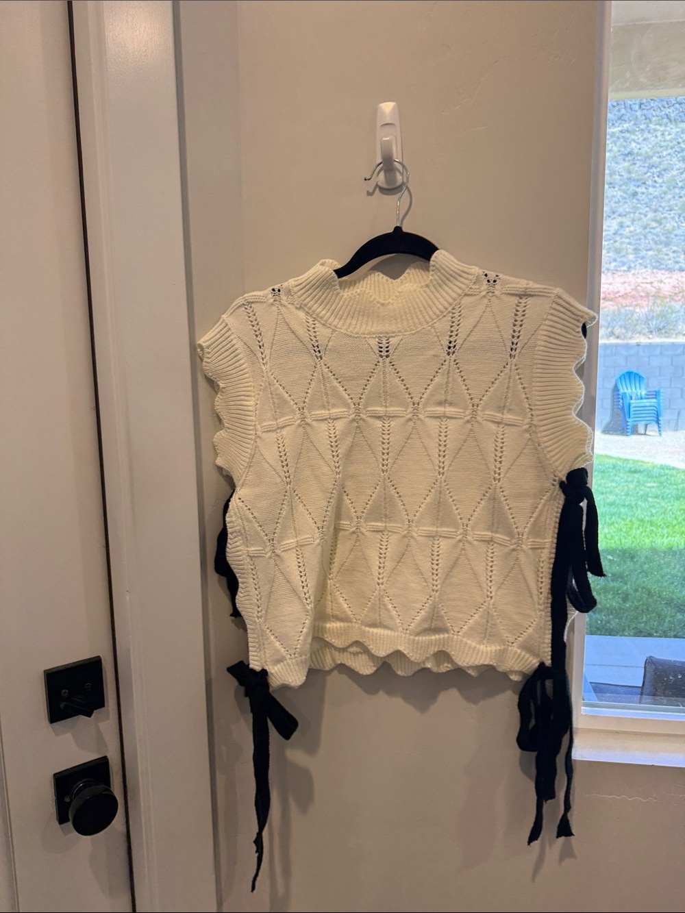 Sleeveless Ivory Knit Sweater Vest with Side Tie Detail